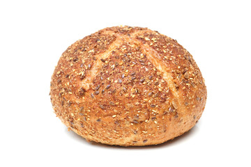 Round multigrain bread bun isolated on white background