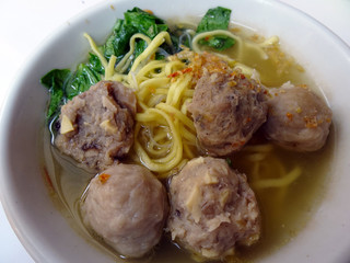 Variance of meatballs in white bowl