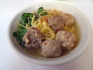 Variance of meatballs in white bowl