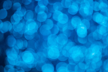 abstract blur or defocused lights bokeh on blue background