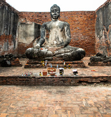 Buddha statue inside Wat Wora Chet Tha Ram, a Buddhist temple of archaeological park, Ayutthaya, Thailand
