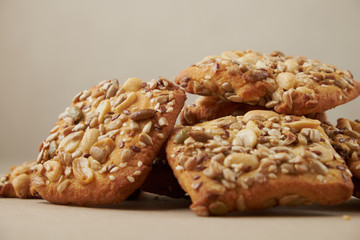 oat cookies chips and ingredients banana walnuts almonds raisin dried apricots on wooden table soft focus close up