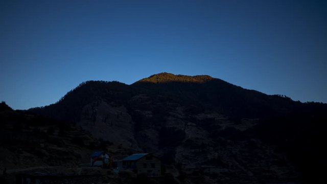 Sun-set timelapse hides a hill in the Shinja Valley, Jumla, Nepal. Wide Shot.