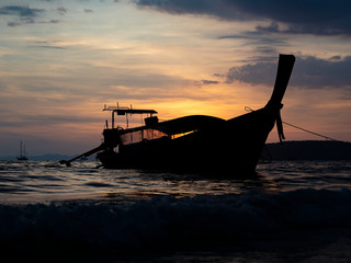 Traditional long-tail boat on the beach in Thailand