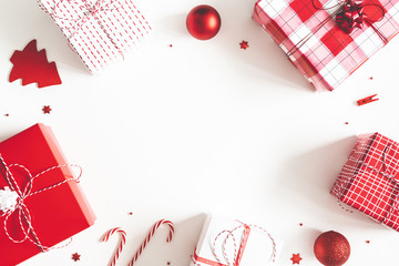 Christmas composition. Gift box, christmas decorations on white background. Flat lay, top view, copy space