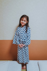 Cute Asian girl dressing in Japanese Yukata