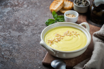 Vegetarian white cauliflower cream soup in a white bowl