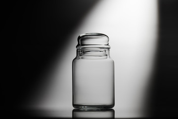 Empty glass jar on a white background