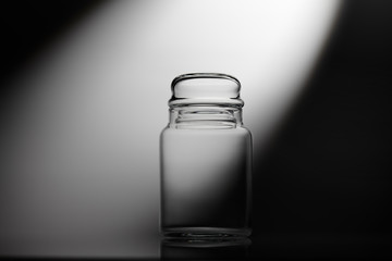 Empty glass jar on a white background