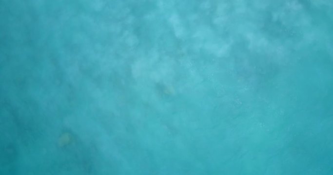 Abstract texture from seabed troubled by underwater currents that rise to the surface white sand from bottom of the sea, copy space