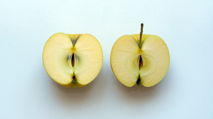 Organic yellow apple on a white background