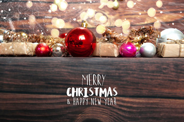 Christmas background with decorations, celebration balls on wooden board