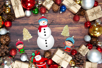 Christmas background with decorations, celebration balls on wooden board