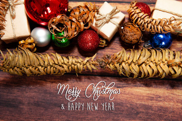 Christmas background with decorations, celebration balls on wooden board