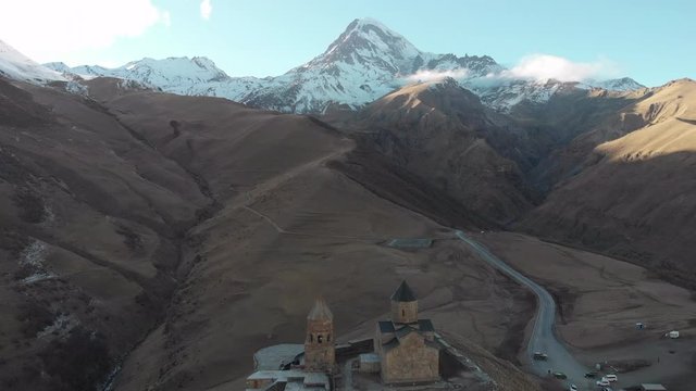 Old stone monastery among the snowy mountains