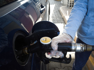Refueling in a petrol pump before embarking on a journey.