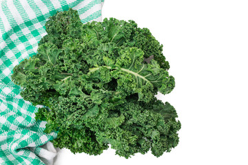 curly natural vegetable with dishcloth on white background