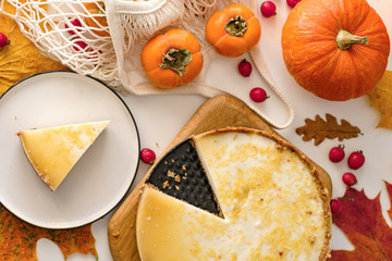 pumpkin cheesecake with persimmon. autumn concept.