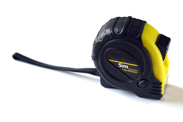Single yellow and black tape measure isolated on a white background