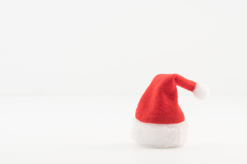 Colourful red Santa hat isolated against a white background.
