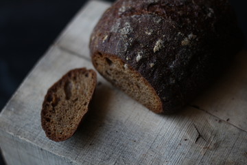 rye bread on a wooden background with a cut off crust