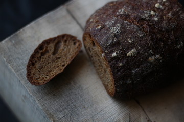 rye bread on a wooden background with a cut off crust