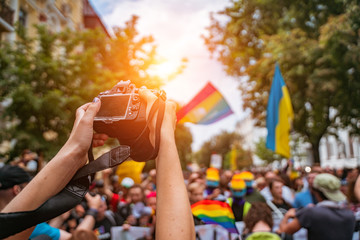 Correspondent takes photo during the Gay Pride parade
