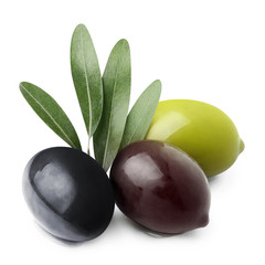 Delicious red, black and green olives with leaves, isolated on white background