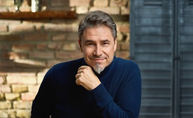 Portrait of happy older man indoors