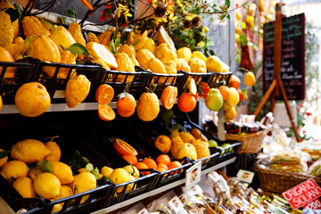 Different variety of lemons for sale. Traditional delicious Italian lemons in Taormina, Sicily, Italy on farmer market. - obrazy, fototapety, plakaty