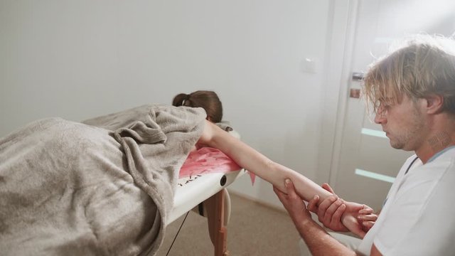 Massage concept. Beautiful young woman reciving relxing massage