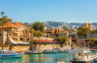 Fototapeta na wymiar Mediterranean Jbeil port lagoon with anchored fishing boats, Biblos, Lebanon
