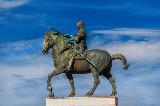 Gattamelata bronze equestrian statue among clouds, in the historic center of Padua, erected by the famous renaissance artist Donatello in 1453