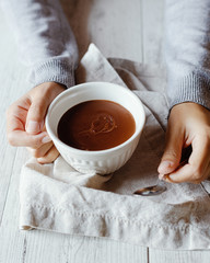 Traditional hot cocoa in a mug on the table