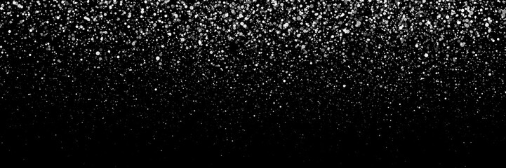 Falling snowflakes on dark background. Snowfall. Falling snowflakes in different shapes and forms. Christmas snow for the new year. Winter Christmas background