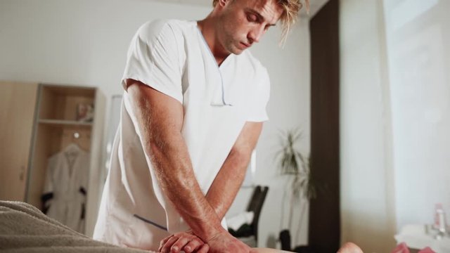 Massage concept. Beautiful young woman reciving relxing massage