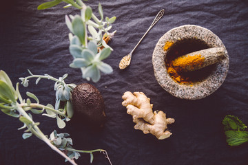 Top-down view with organic herbs and CBD related natural medicine. such as  ingredients such as...