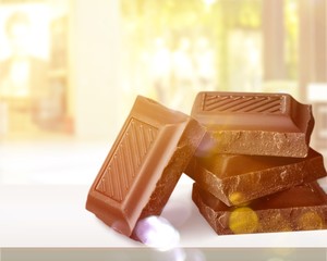 Delicious chocolates isolated on background