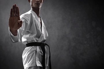 Karate martial arts fighter on dark background