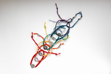 set of beaded bracelets with chakras on a white background