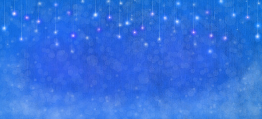 Christmas time. Blue blur abstract background with snowflakes. Blur shiny Christmas lights.