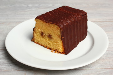 Chocolate glazed loaf cake with strawberry jam