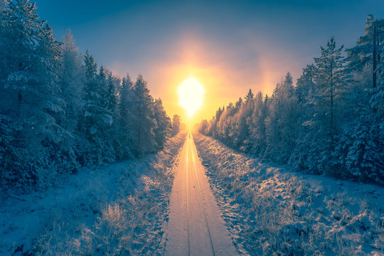Snowy winter railroad view. First snow sunset landscape. Photo from Sotkamo, Finland.