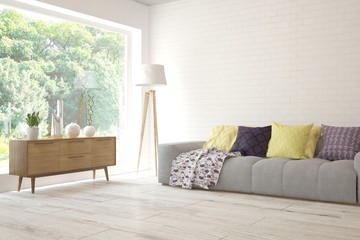 Stylish room in white color with sofa and summer landscape in window. Scandinavian interior design. 3D illustration