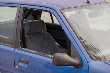 Obsolete car with broken window