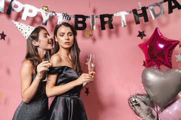 Women friends at the happy birthday party gossiping
