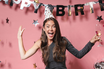 Optimistic beautiful young woman at the happy birthday party