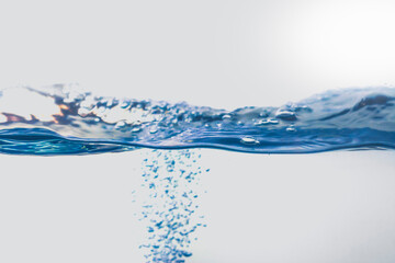 Water splash with bubbles of air, isolated on the white background.