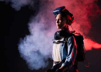 Girl with glasses of virtual reality on head. Virtual reality, science, future technology, fantastic, robots and people concept. Neon backlit