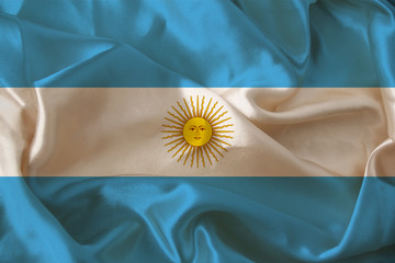 beautiful photo of the colored national flag of the modern state of Argentina on textured fabric, concept of tourism, emigration, economics and politics, closeup